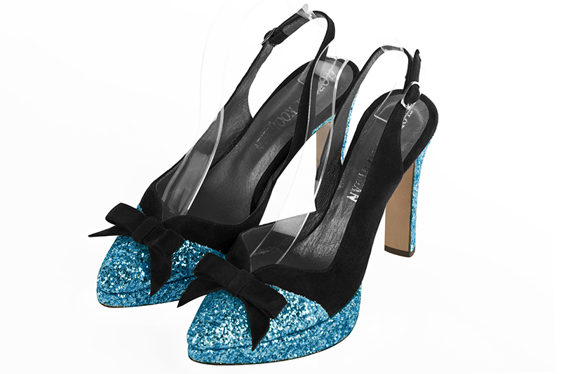 Turquoise blue and matt black women's open back shoes, with a knot. Tapered toe. Very high slim heel with a platform at the front. Front view - Florence KOOIJMAN